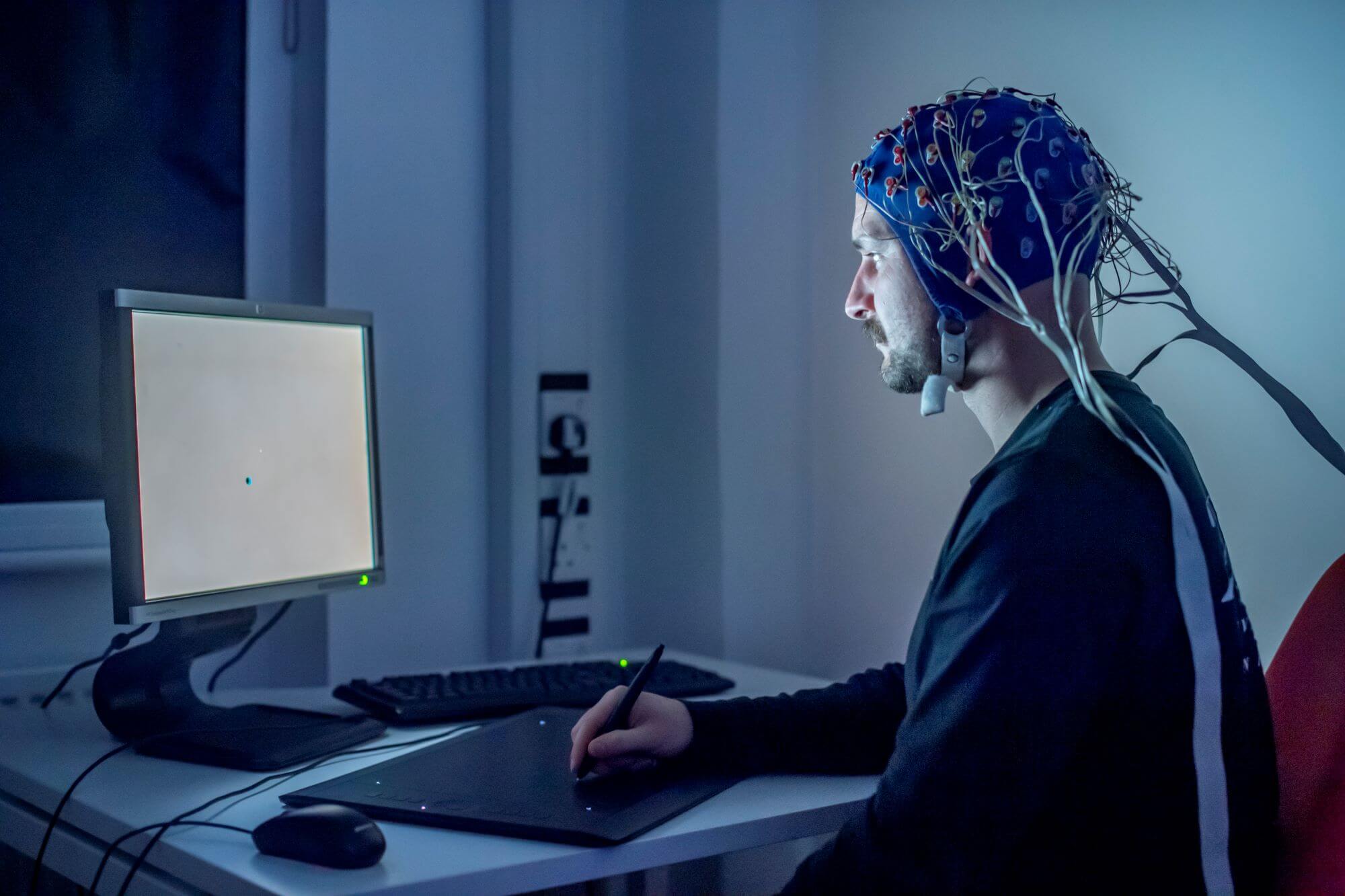 Researcher wearing an EEG cap during a study session